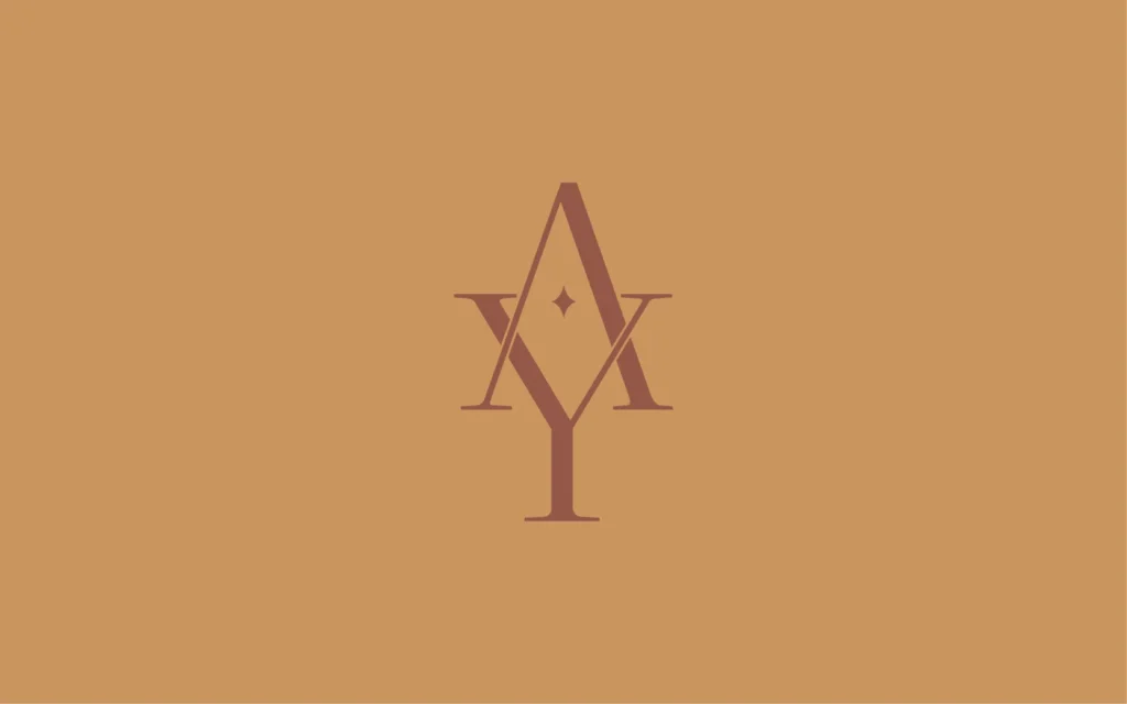 alt="Logo Atelier Yogi marron sur fond marron clair"